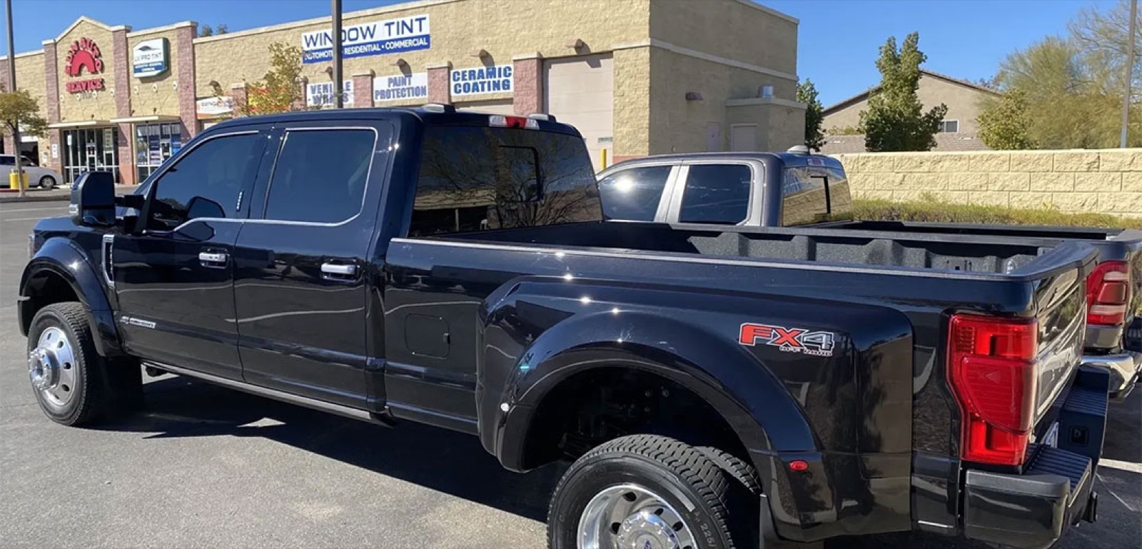 Polar Tint branded work truck parked at a Henderson storefront