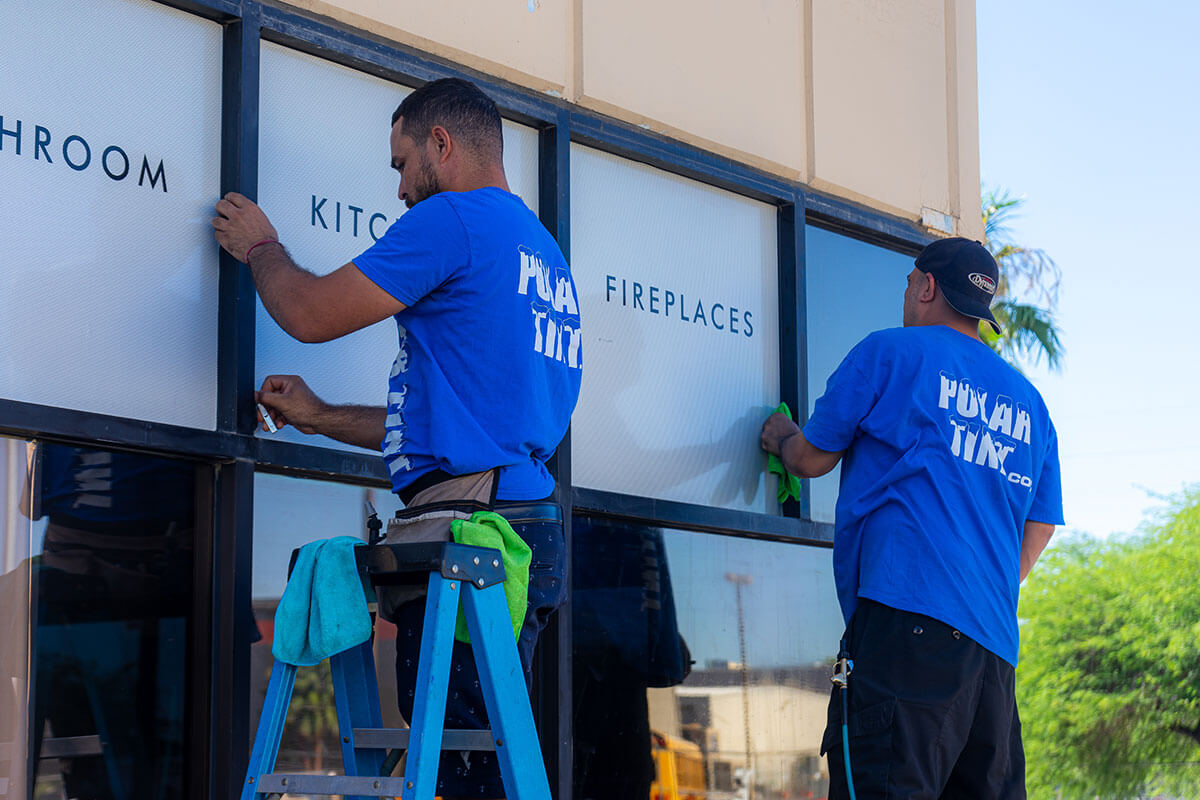 Custom vinyl decal install on a Henderson NV work truck door — brand logo, phone number, and contact information
